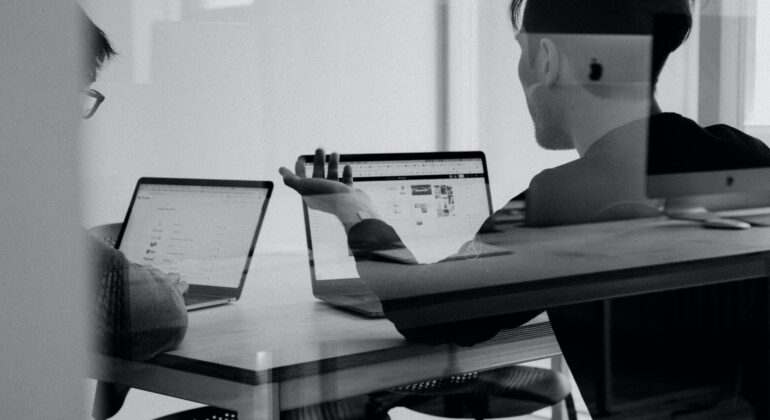 Python developers working with a computer