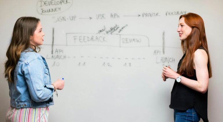 women discussing with flipboard