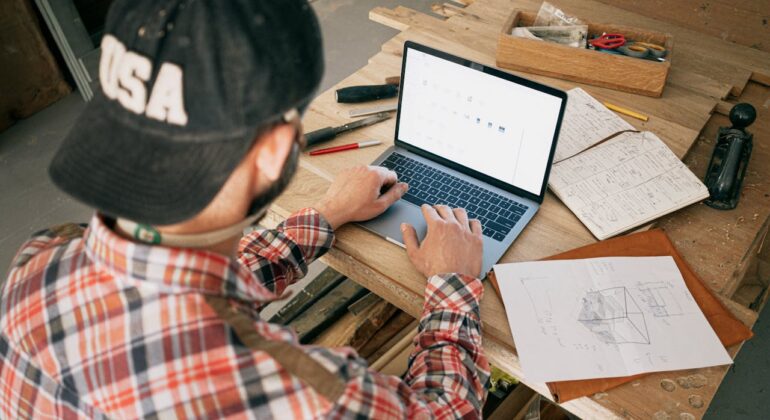 carpenter with laptop