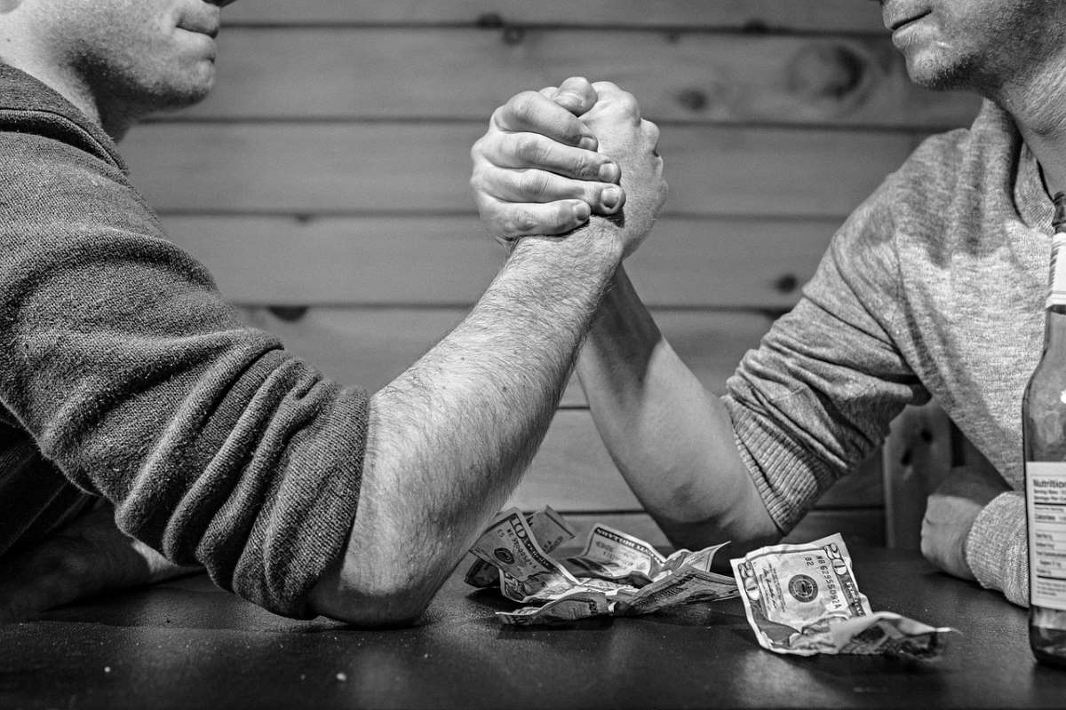 2 men doing arm wrestling