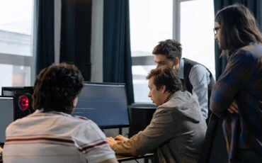 software developers around a single computer