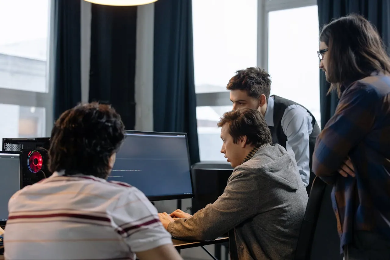 software developers around a single computer