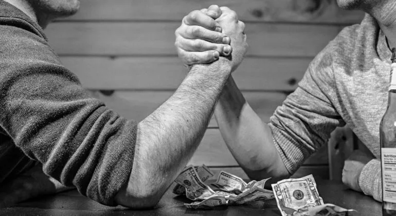 2 men doing arm wrestling