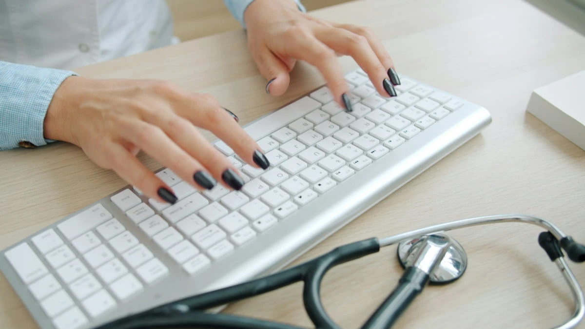 female doctor typing