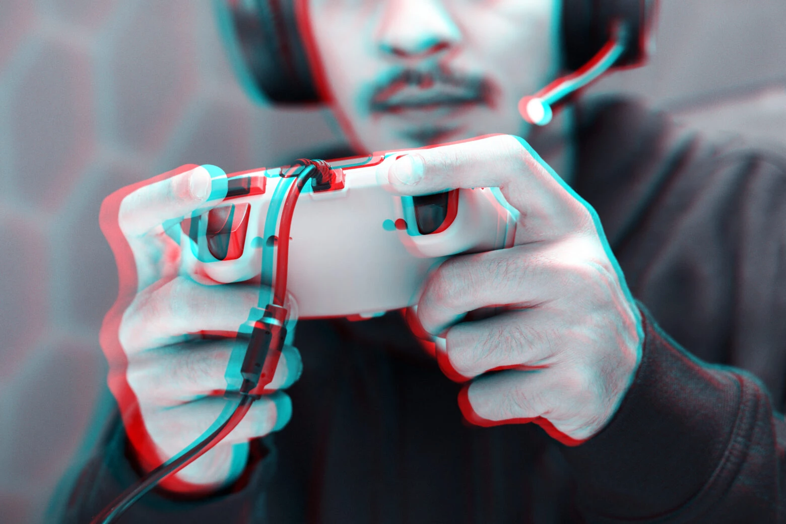 guy playing playstation with a dual shock controller